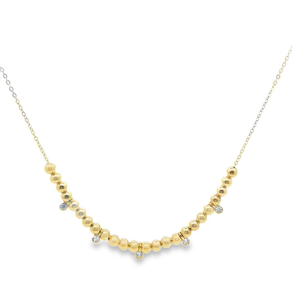 Gold beaded necklace on a white background