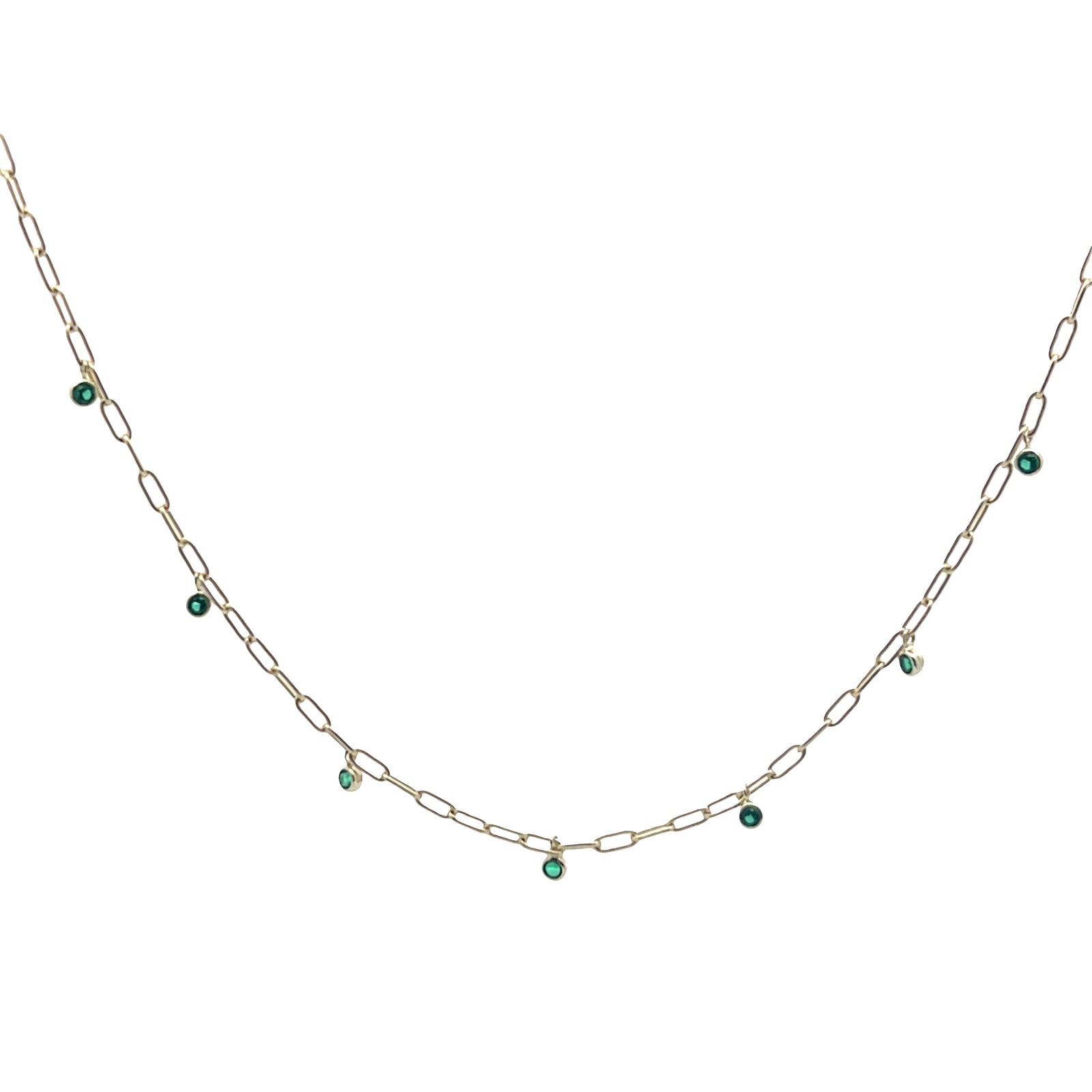 Gold chain necklace with green gemstones on a white background