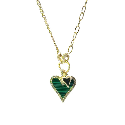 Necklace with a green heart-shaped pendant on a white background